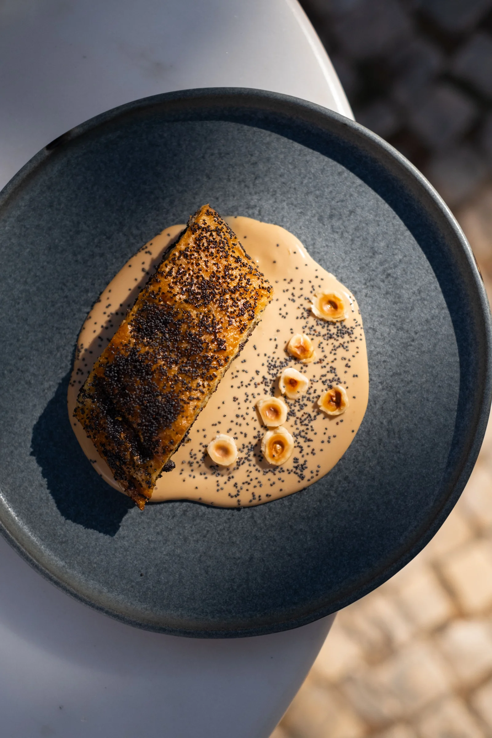 Poppy-seed dessert with hazelnuts and sauce at Zula Bistro
